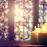Candles burning in a church background Candles burning in a church background